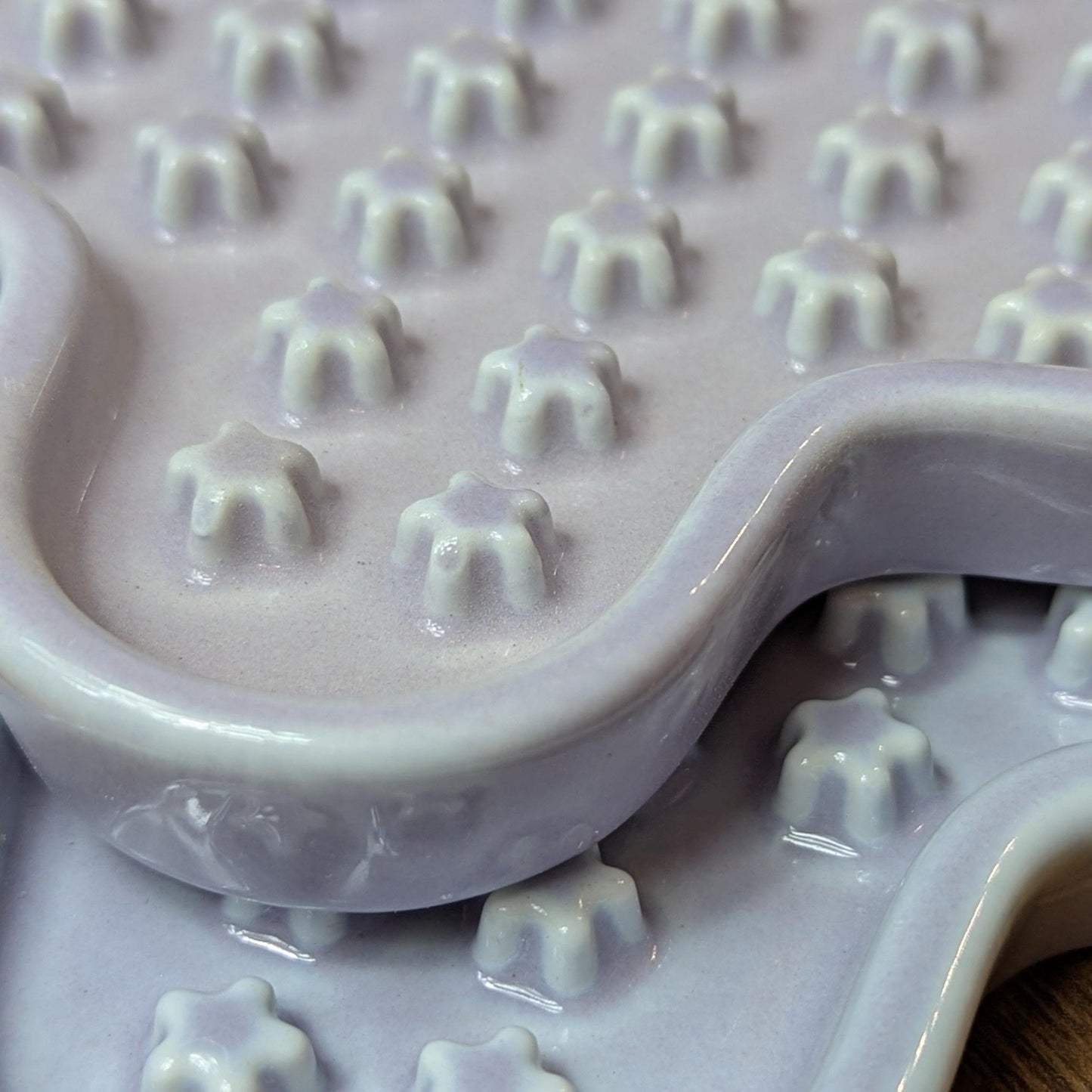 Ceramic Cat Lick Mat, a puzzle slow feeder for cats. Just like a Lickimat, but made from ceramic.