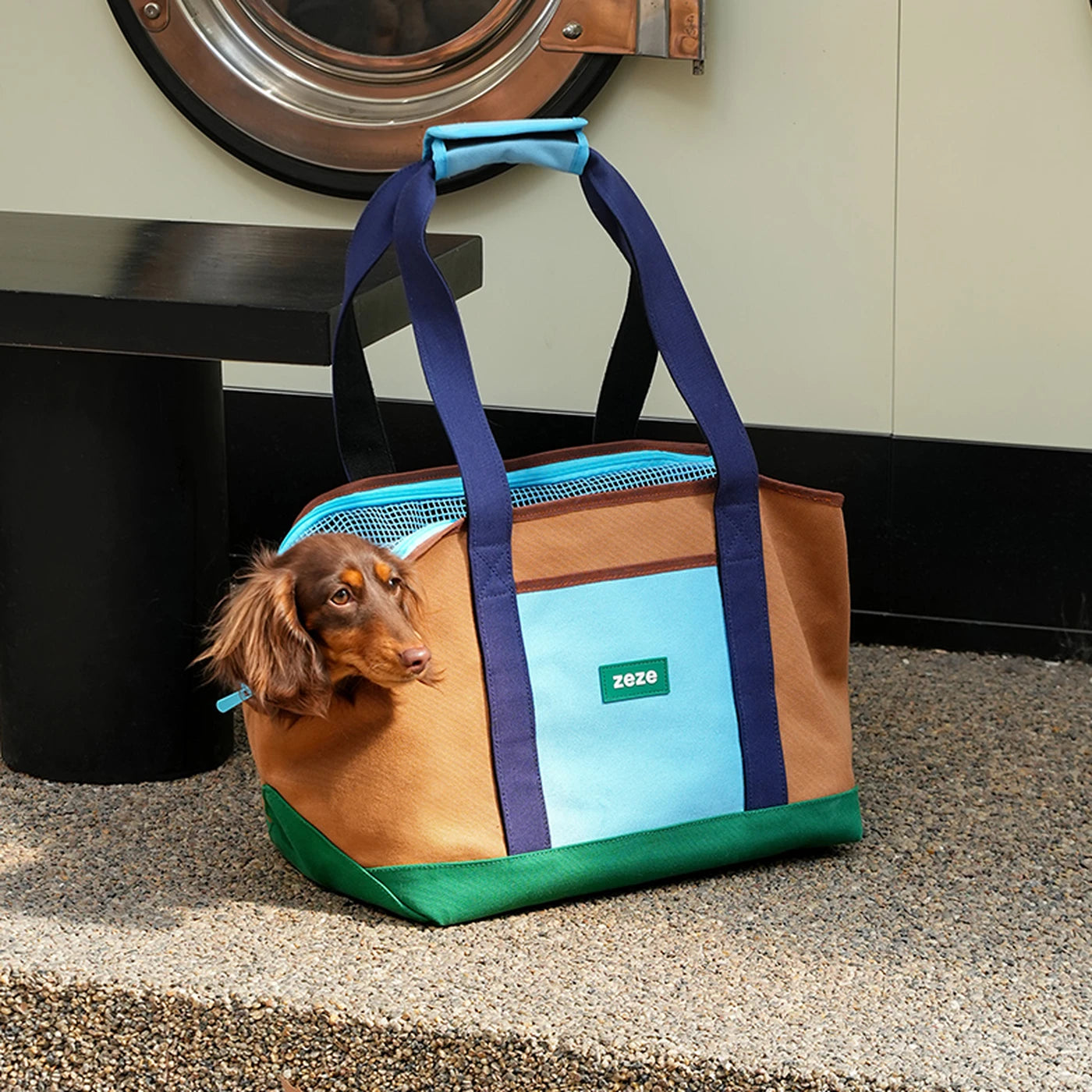 ZEZE brown, turquoise, and green canvas pet carrier with a small dog peeking out.