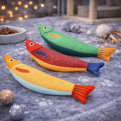 Three colorful 24cm fabric fish catnip toys in green, red, and yellow, on a grey mat with paw prints.