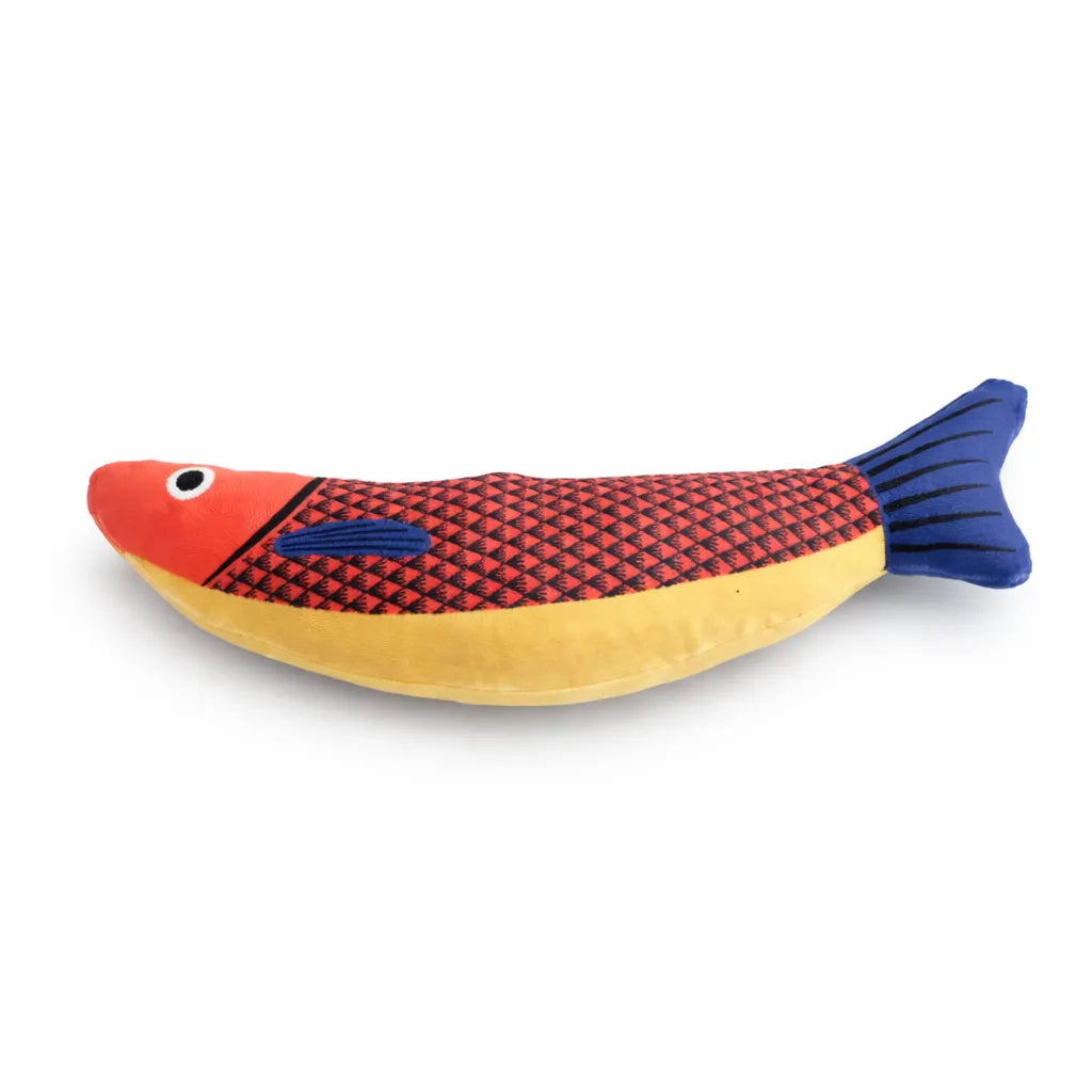 Red, yellow, and blue fish-shaped catnip toy with black scale pattern and blue striped tail.