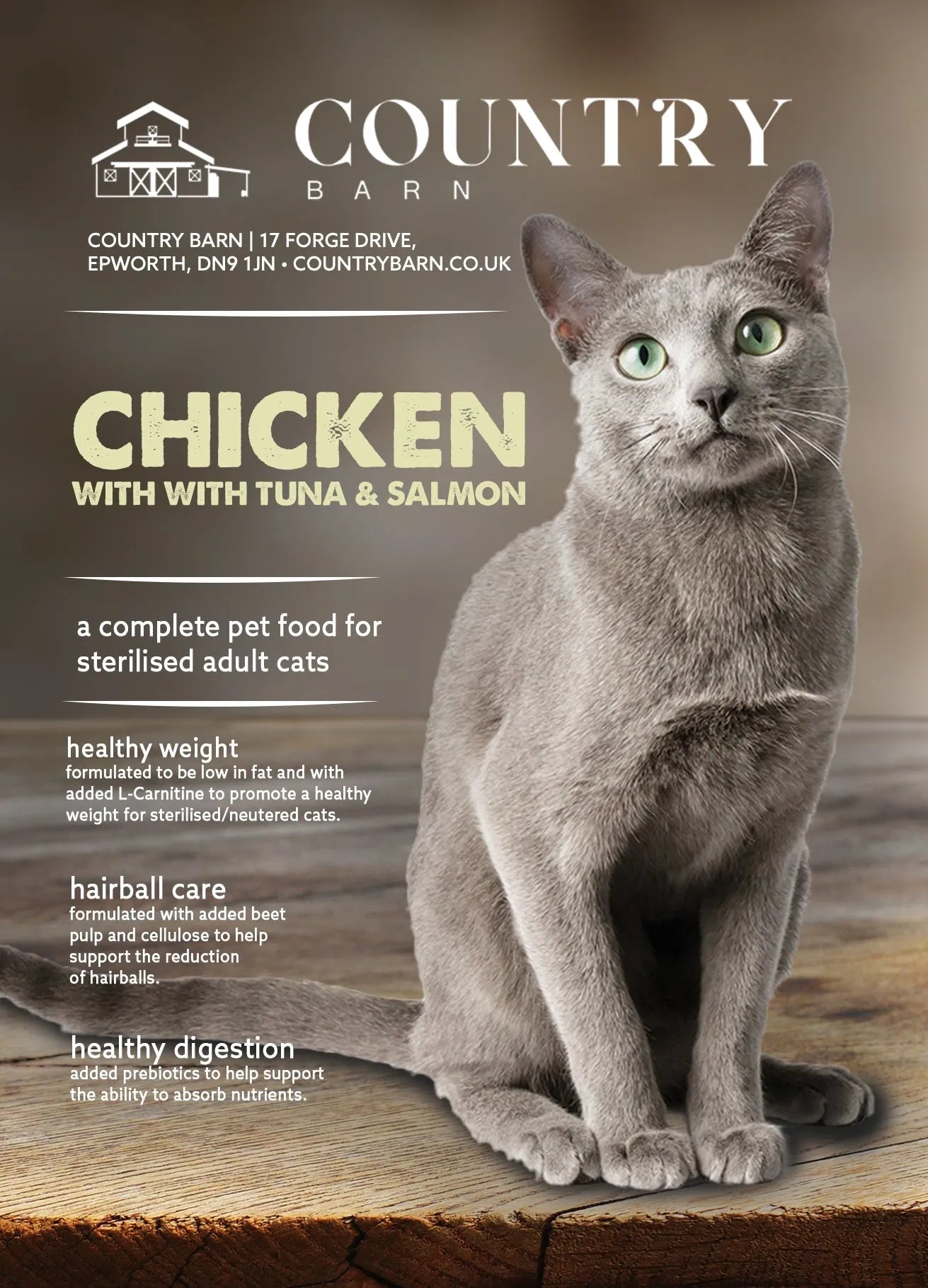 Grey cat with green eyes sitting on a wooden surface, next to text about chicken, tuna & salmon cat food.