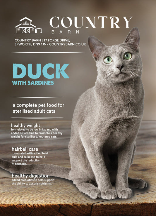 Elegant grey Russian Blue cat sitting on a rustic wooden surface, advertising "Duck with Sardines" cat food.