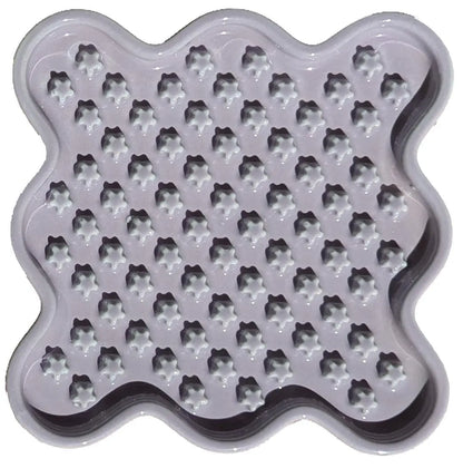 Light purple ceramic Fussy Cat slow feeder with wavy edges and star-shaped nubs.