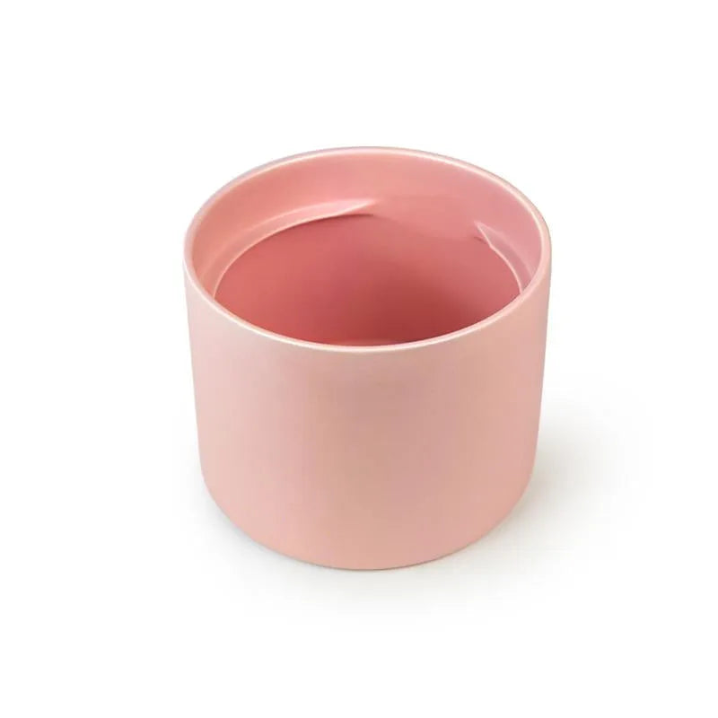 Pink ceramic Fussy Cat water fountain with a smooth, cylindrical design.