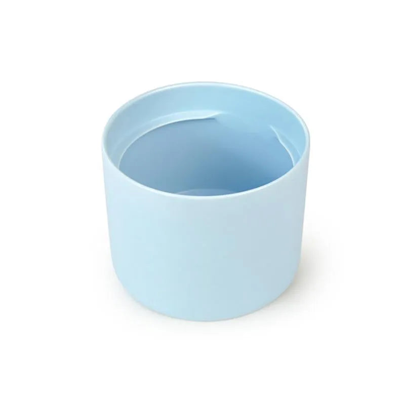 Light blue ceramic Fussy Cat water fountain with a smooth, cylindrical design.
