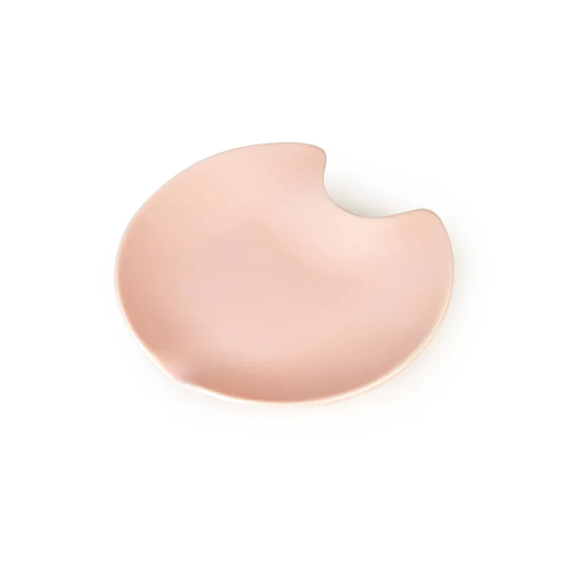 Pink ceramic Fussy Cat water fountain with a curved, spill-resistant design.