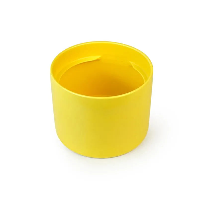 Bright yellow ceramic Fussy Cat water fountain base with a smooth, cylindrical design.