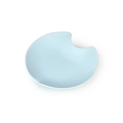 Light blue ceramic Fussy Cat water fountain with a unique, spill-resistant, curved design.
