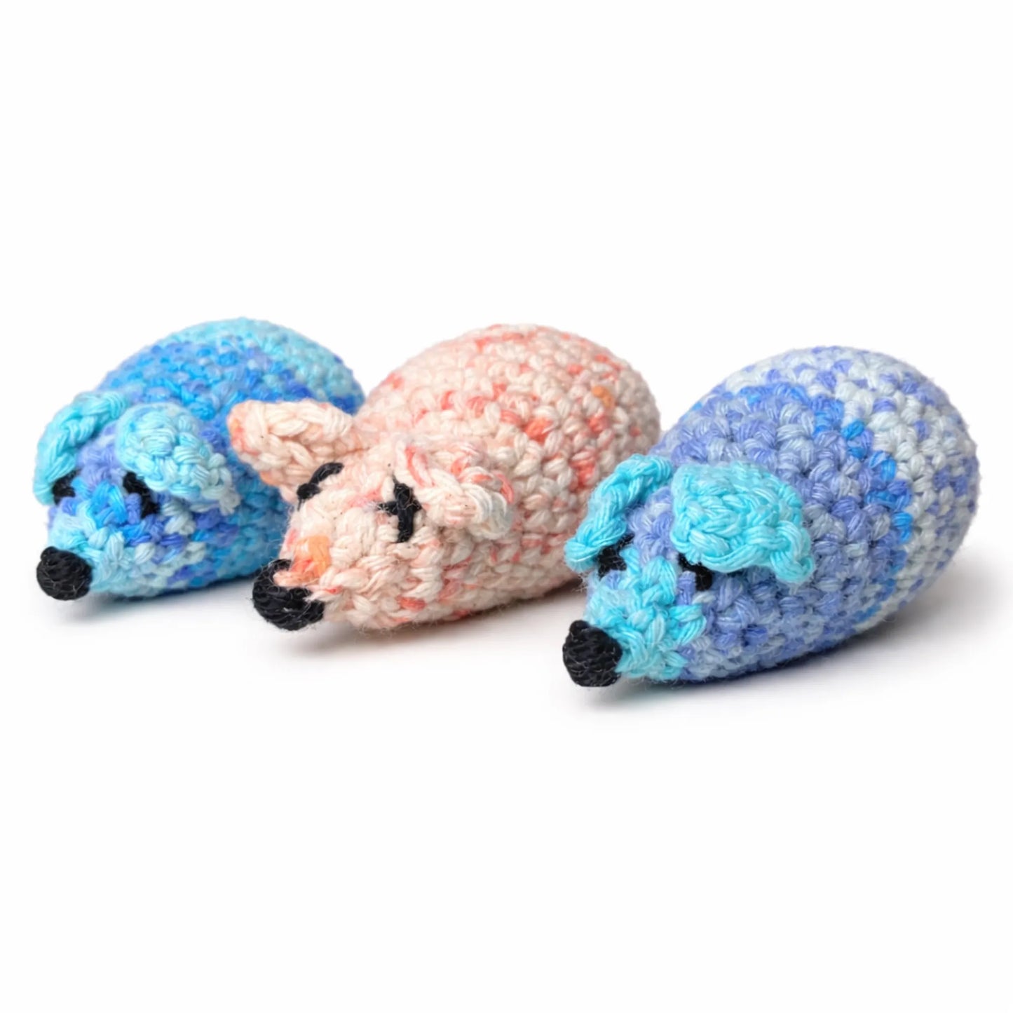Three unique, handmade crocheted wool catnip mouse toys in blue, pink, and purple hues.