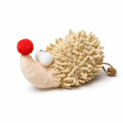 Beige plush hedgehog cat toy with a red pom-pom nose and white eyes, featuring a textured back.