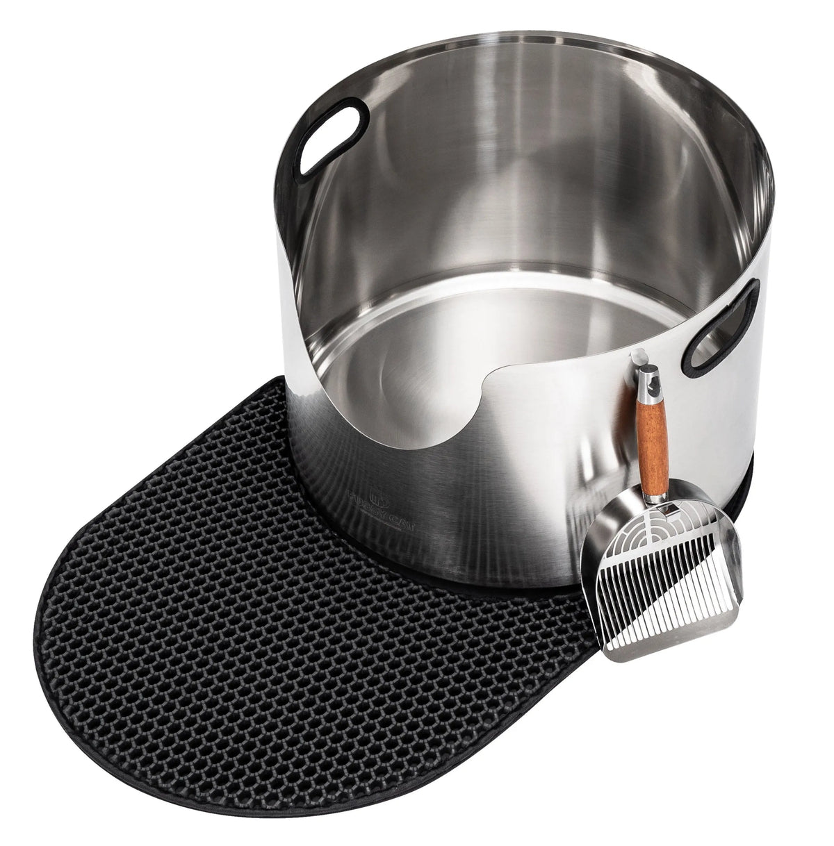 Black honeycomb litter mat next to a round stainless steel litter box and metal scoop with wooden handle.