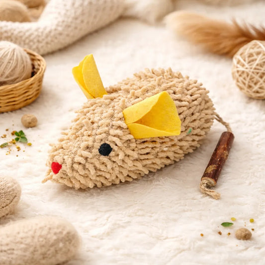 Beige textured plush mouse cat toy with yellow felt ears, red nose, black eyes, and a matatabi stick tail.