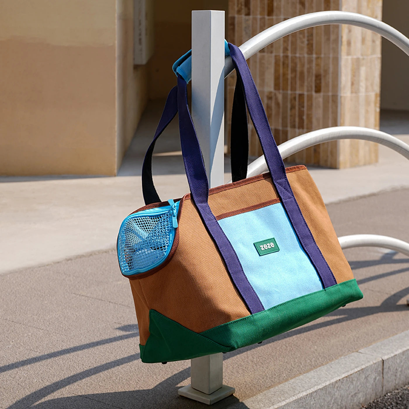 ZEZE brown and turquoise canvas pet carrier, 2-in-1 backpack handbag, with mesh window and side pocket.