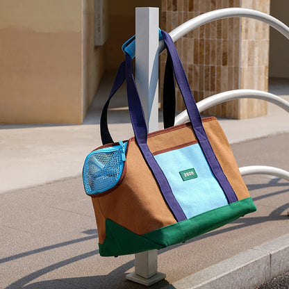 ZEZE brown and turquoise canvas pet carrier, 2-in-1 backpack handbag, with mesh window and side pocket.